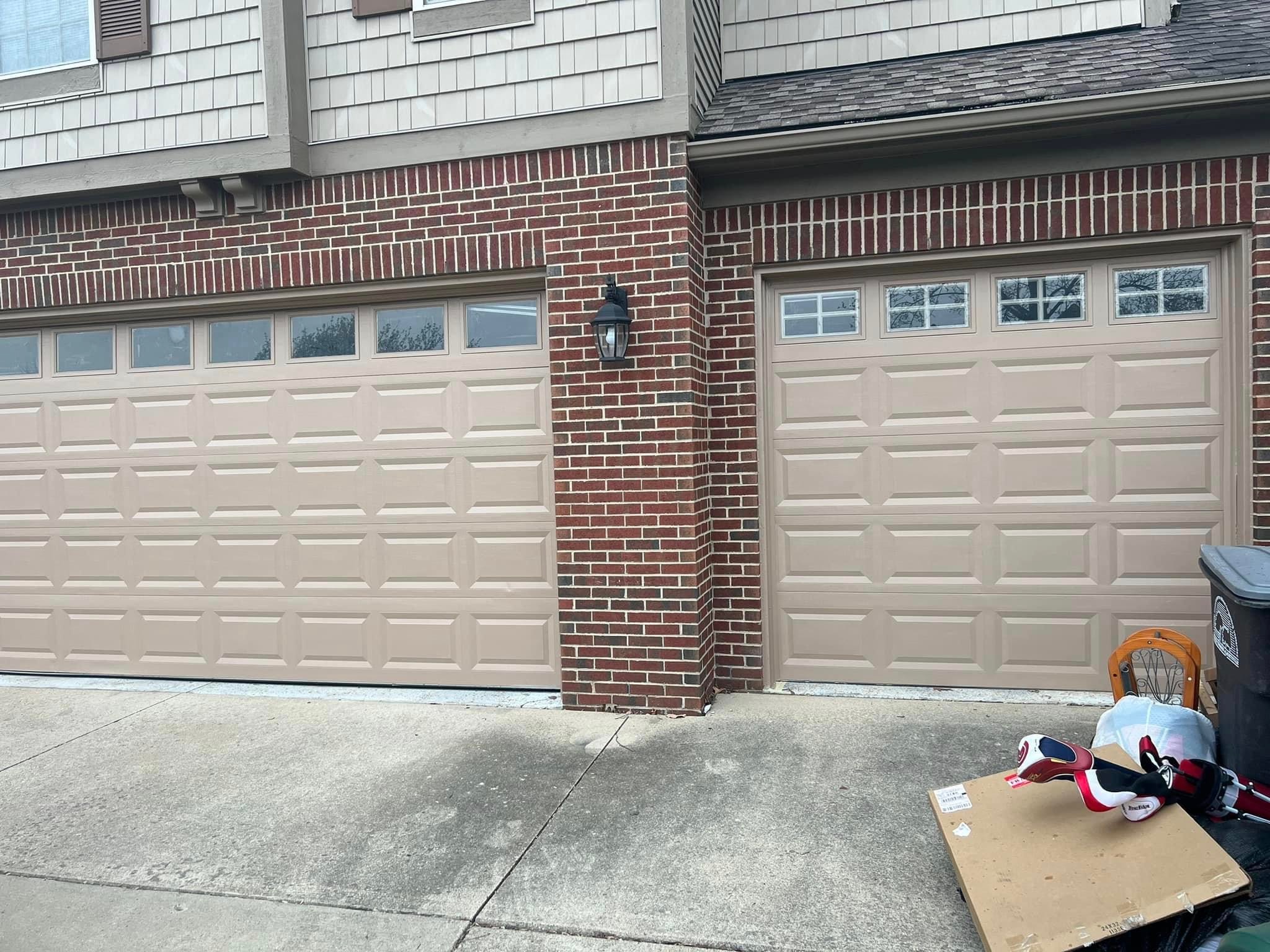 Brick garage with new cream doors — Precision Pro project